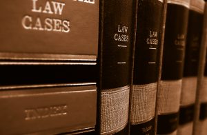 Law cases and law books on a shelf